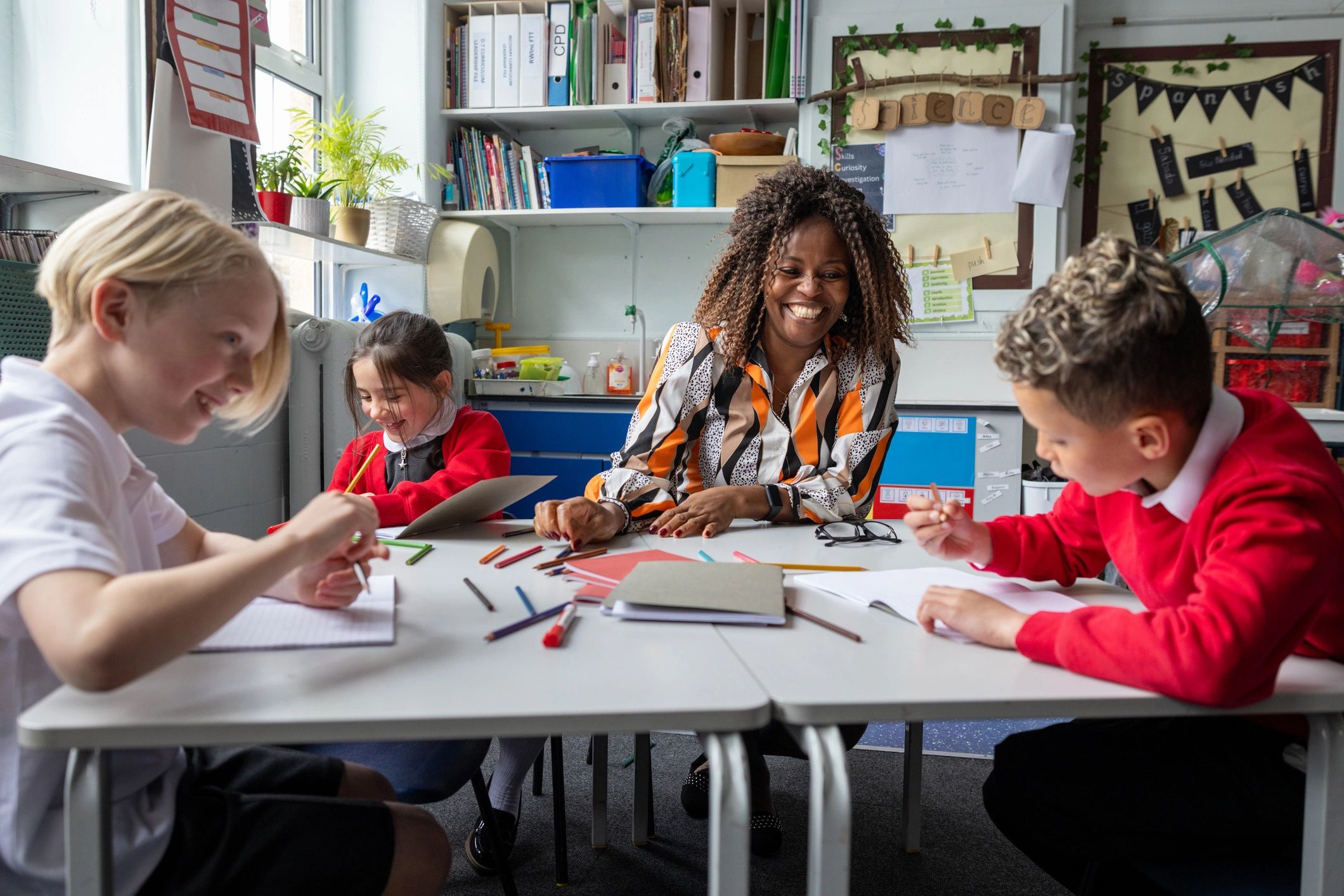 Teacher with students in a classroom