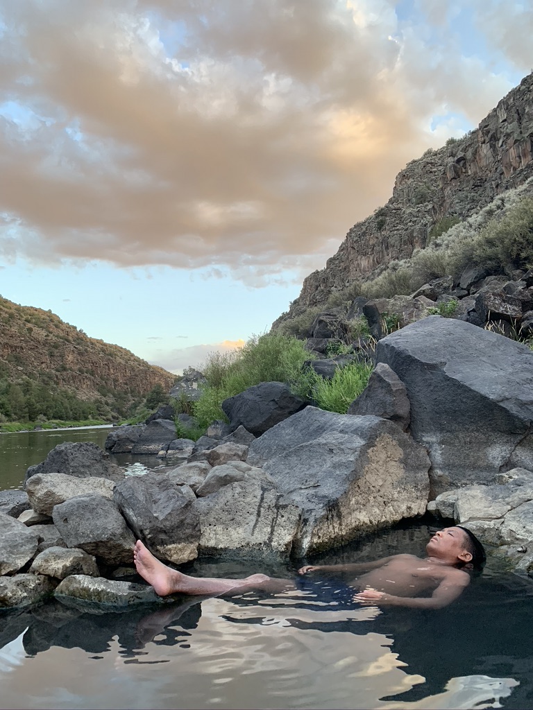 Person in water outside a tide pool