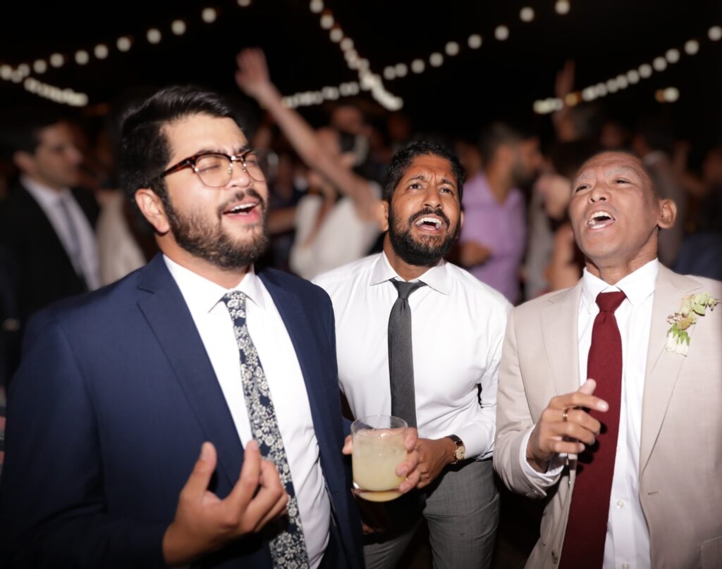 Blurred image of people singing together at Joe's
